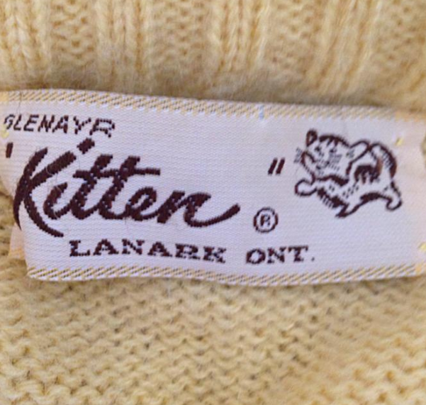 kitten yellow sweater tag